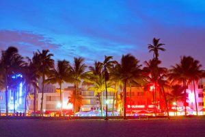 Miami Beach, Florida hotels and restaurants at sunset on Ocean Drive, world famous destination for it's nightlife, beautiful weather and pristine beaches